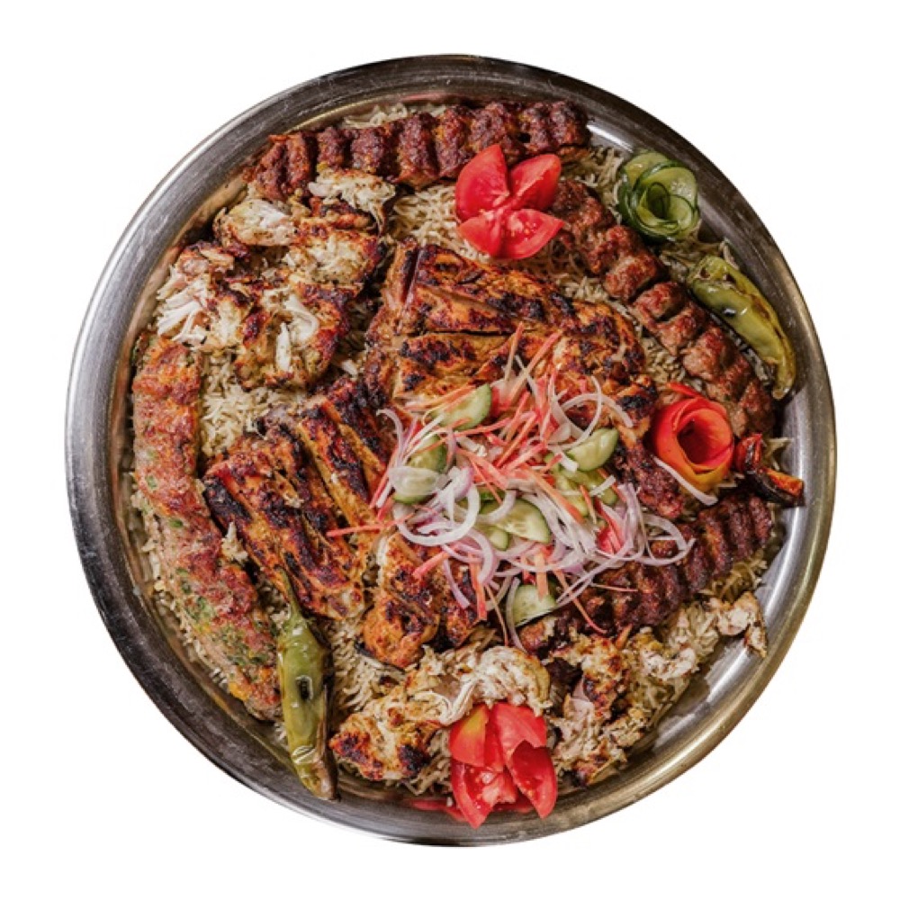 BBQ Feast Family Platter, Malai Boti, 2 Leg Tikkas, Shish Taouk, and Beef & Turkish Kebabs over fragrant rice with veggies and signature sauces, Sufraq Karachi