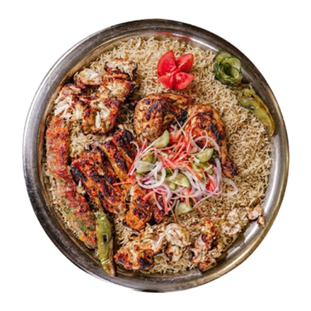 BBQ Feast Platter, Malai Boti, flame-grilled Leg Tikka, and a duo of Chicken & Beef Kebabs over seasoned rice with veggies and sauces, Sufraq Karachi