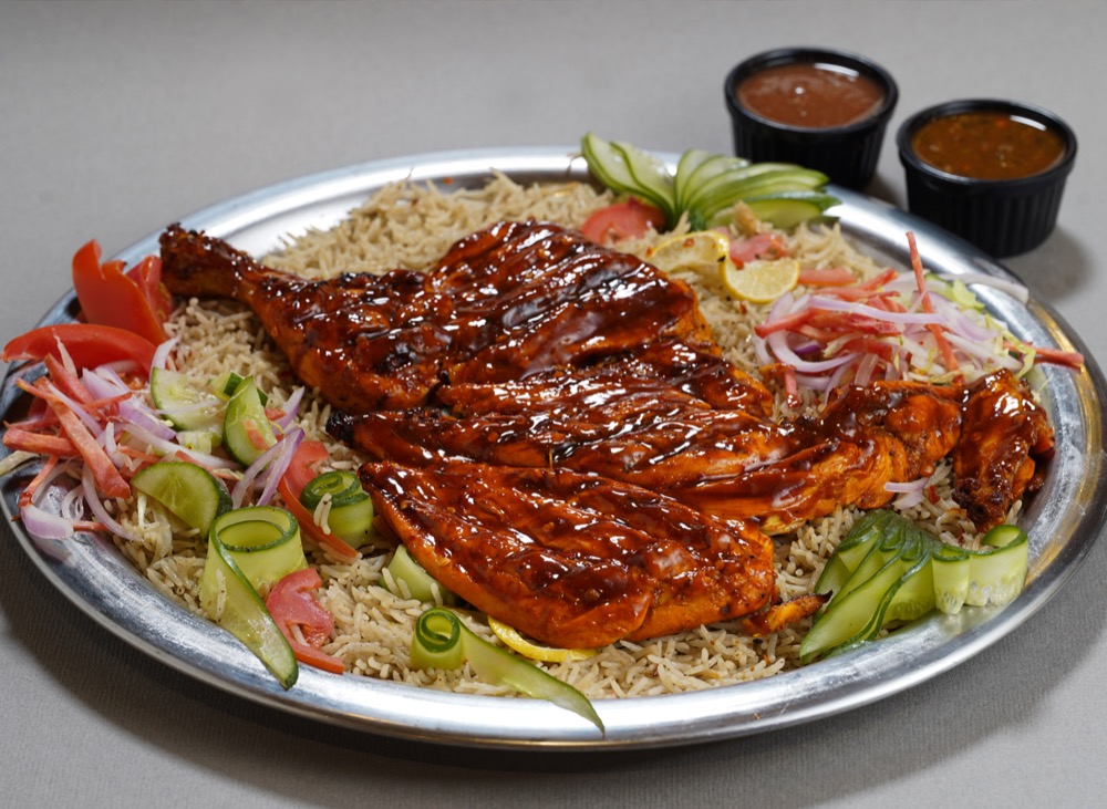 BBQ Mandi, Fragrant mandi rice enhanced with BBQ sauce, topped with grilled chicken, veggies and sauces, Sufraq Karachi